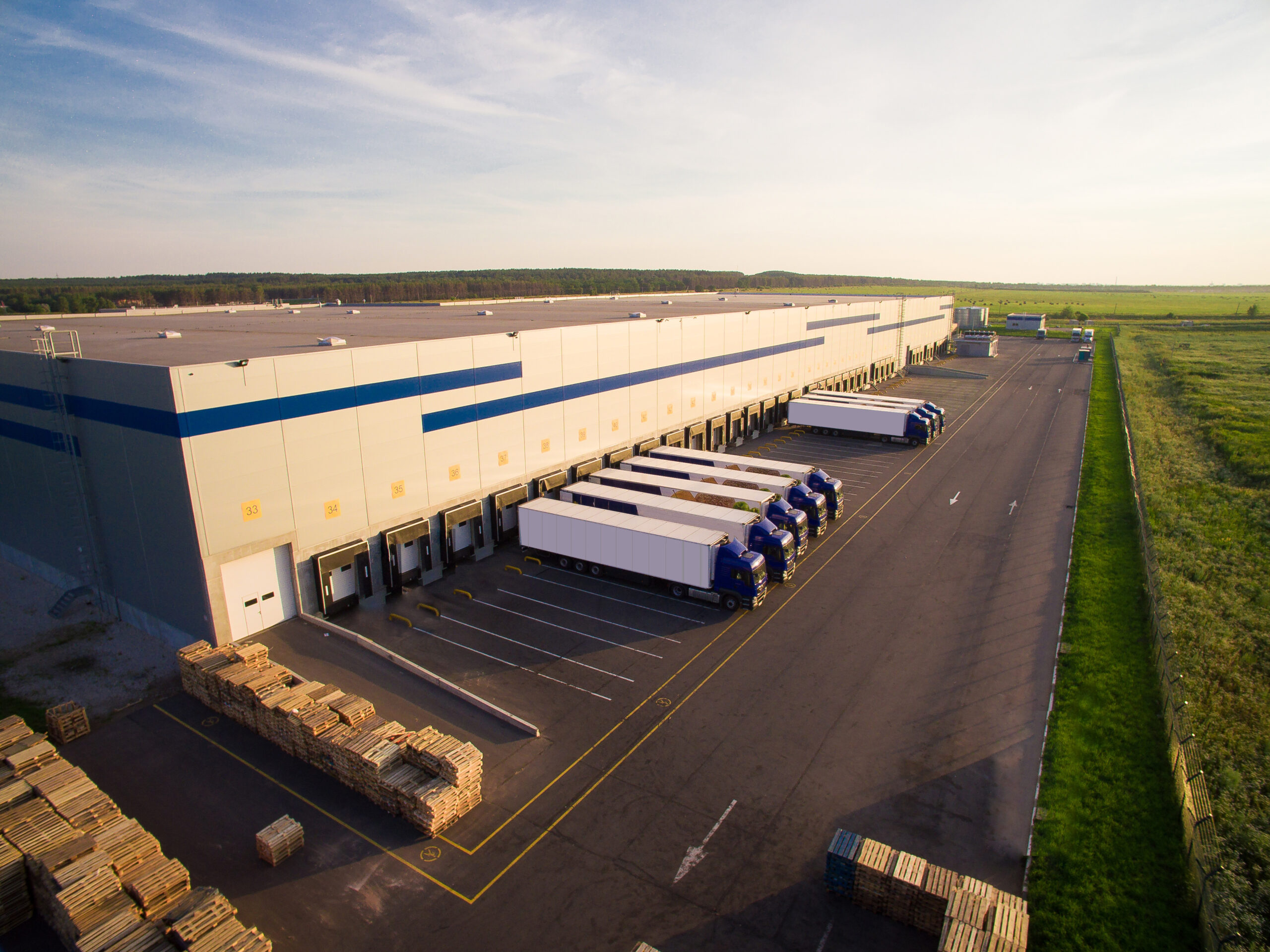 Owner-occupied commercial warehouse with loading docks and business vehicles